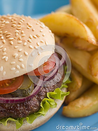 Beefburger with Salad and Pickles in a bun Stock Photo
