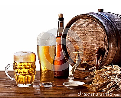 Beer barrel with beer glasses on a wooden table. Stock Photo