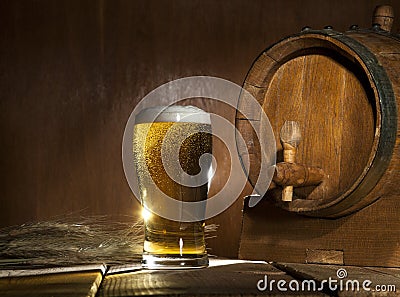 Beer barrel with beer mug on wooden background Stock Photo