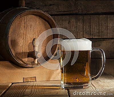 Beer barrel with beer mug on wooden background Stock Photo