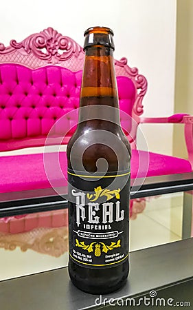 Beer bottle Real Imperial on table drinking alcohol in Mexico Editorial Stock Photo