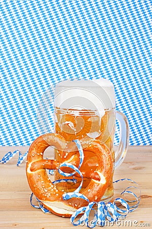 Beer with brezel and paper streamers Stock Photo