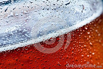 Beer bubbles transparent yellow as the background. Glass full of alcohol with golden foam Stock Photo