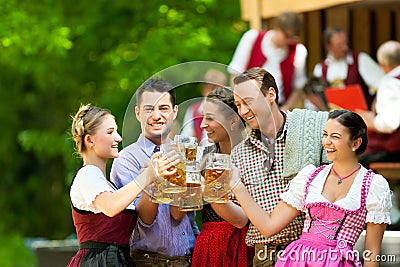 In Beer garden - friends in front of band Stock Photo