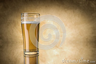 Beer glass on yellow background Stock Photo