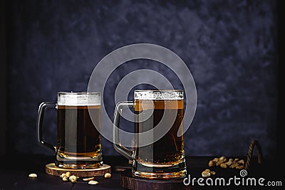 Beer glasses with lager, dark lager, brown ale, malt and stout beer on table, dark wooden background Stock Photo