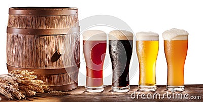 Beer glasses with a wooden barrel. Stock Photo