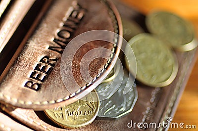 Beer Money. Aussie coins out of a leather wallet Stock Photo