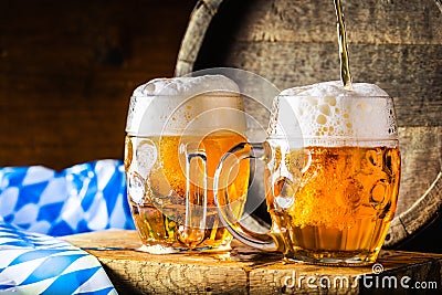 Beer. Oktoberfest.Two cold beers. Draft beer. Draft ale. Golden beer. Golden ale. Two gold beer with froth on top. Draft cold beer Stock Photo