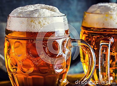 Beer. Oktoberfest.Two cold beers. Draft beer. Draft ale. Golden beer. Golden ale. Two gold beer with froth on top. Draft cold beer Stock Photo