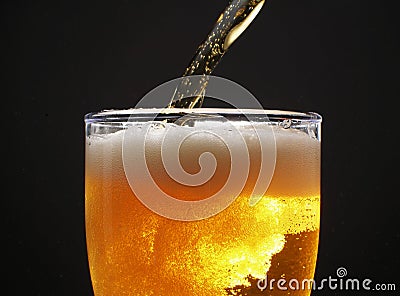 Beer over black Stock Photo