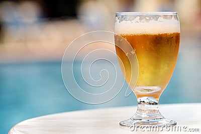 Beer by the pool Stock Photo