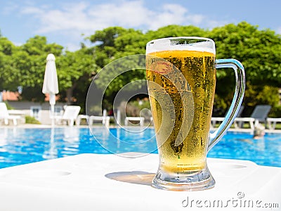 Beer by the pool Stock Photo