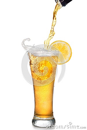 Beer pouring from bottle into glass Stock Photo