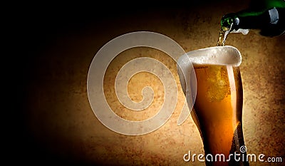 Beer pouring into glass Stock Photo