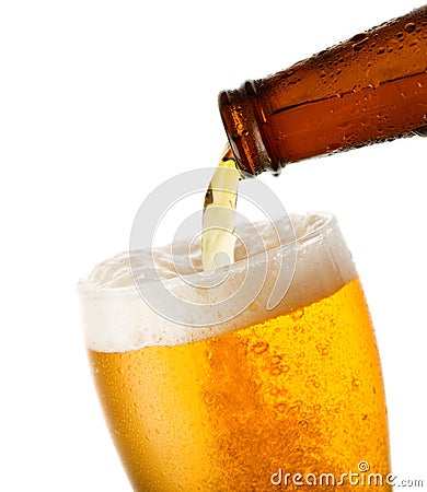 Beer is pouring into glass Stock Photo