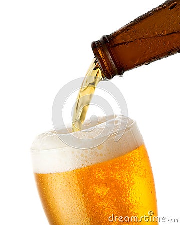 Beer is pouring into glass Stock Photo