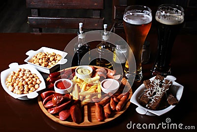 Beer Set . French fries , sausage mix ,garlic bread , stew peas Stock Photo