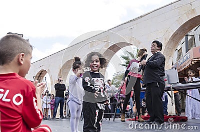 Beer-Sheva, ISRAEL - March 5, 2015: Speech at the street scene of artists and children viewers -Purim Editorial Stock Photo