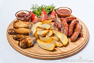 Beer snack set with tomato sauce, adzhika on a wooden board Stock Photo