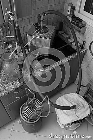 Beer stripping distillation of thick fruit mash in a home kitchen by Steam Injection Stock Photo