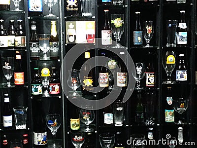 Belgian beer collection with matching glasses Editorial Stock Photo