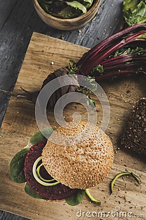 Beet burger sandwich on a table Stock Photo