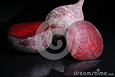 Beetroot beet on black reflective studio background. Isolated black shiny mirror mirrored background for every concept... Stock Photo