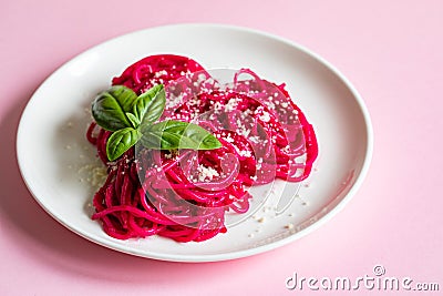 Beetroot Pasta, Barbie Themed Pasta. Pink noodles on pink background Stock Photo