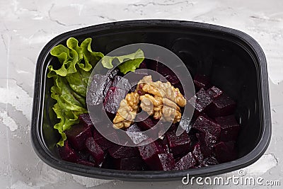 Beets, nuts, Turnips, parsley and Onion Salad in black box Stock Photo