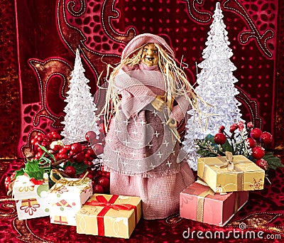 The Befana with yellow straw hair on Christmas background. Traditional witch costume. Stock Photo