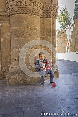 Beggar Boy Playing Accordian Editorial Stock Photo