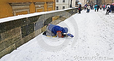 A beggar on the Charles bridge of prague Editorial Stock Photo