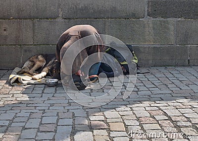 Beggar with his dog on Charlese bridge, Prague, Czech Republic Editorial Stock Photo