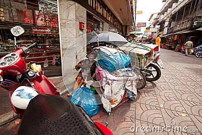 Beggar on the street in Chinatown Bangkok. Editorial Stock Photo