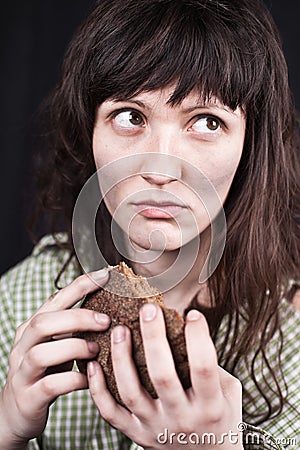 Beggar woman with a piece of bread Stock Photo