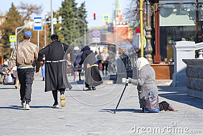 Beggars begging near the Cathedral of Christ the Savior in Moscow Editorial Stock Photo
