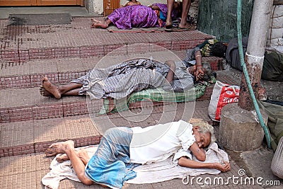 Beggars in front of Nirmal Hriday, Home for the Sick and Dying Destitutes in Kolkata Editorial Stock Photo
