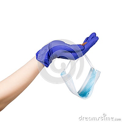 Begging hand with latex glove and safety mask on it. Some coins in the hand. Isolated on white background. Stock Photo