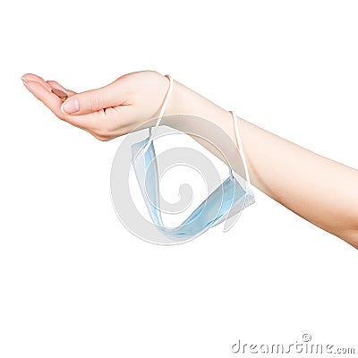 Begging hand with safety mask on it. Some coins in the hand. Isolated on white background. Stock Photo