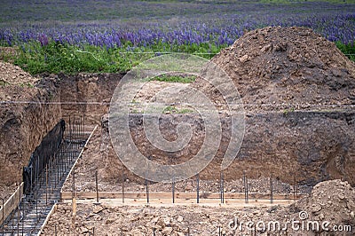 The beginning of the construction of the house with the preparation of the pouring of the concrete foundation Stock Photo