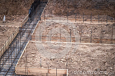 The beginning of the construction of the house with the preparation of the pouring of the concrete foundation Stock Photo