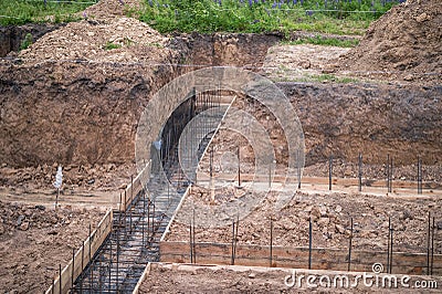 The beginning of the construction of the house with the preparation of the pouring of the concrete foundation Stock Photo