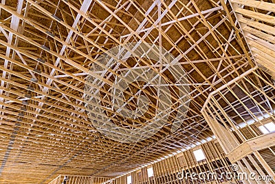 Beginning unfinished roof trusses construction with home construction the frame of house Stock Photo