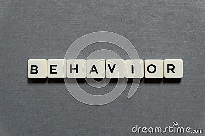 Behavior word made of square letter word on grey background. Stock Photo