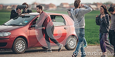 Behind scene improvisation. Film crew team pushing car with came Stock Photo