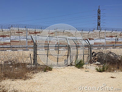 CLosed gate to wall, sign of Israeli occupation Stock Photo