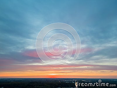 Aerial Drama: Colorful Sunset Under Clouded Sky Stock Photo