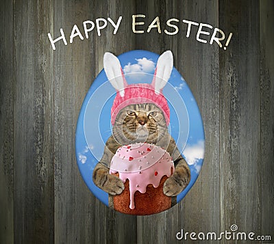 Cat with easter cake in hole of fence 2 Stock Photo