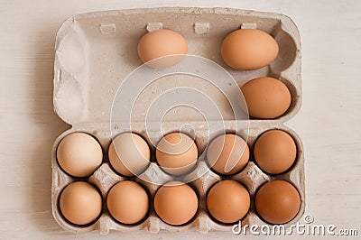 Beige chicken eggs in a carton. Vegetarian natural eco products. Food Gradient Stock Photo